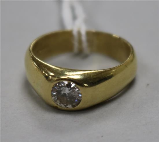An 18ct gold and gypsy set solitaire diamond ring, size K.